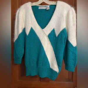 Vintage knitted turquoise sweater with Angora trim and padded shoulders.